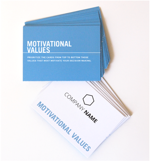 A stack of blue cards labeled Motivational Values sits next to white cards with Company Name and Motivational Values printed on them, used for prioritizing decision-making values.