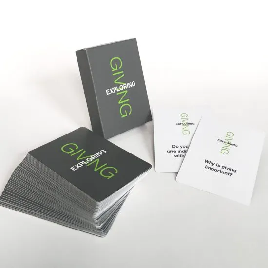 A deck of cards labeled EXPLORING GIVING with some cards fanned out and two visible cards displaying questions: Do you give individually or with others? and Why is giving important?.